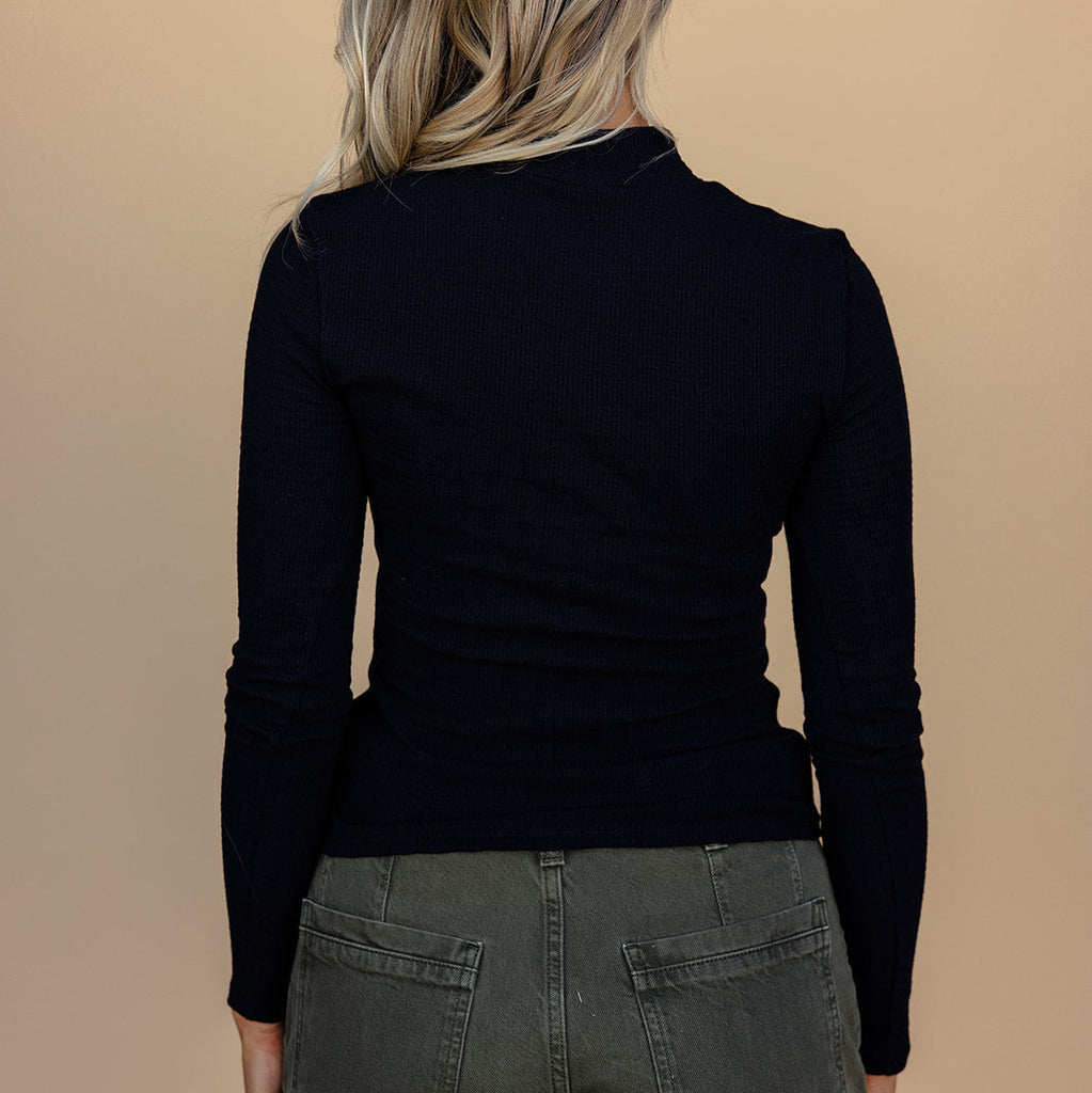 The mock neck gives it edge while the textured material makes it stand out. Plus, it’s stretchy and hugs your shape perfectly