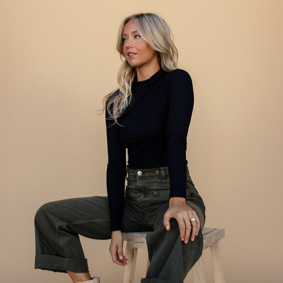 The mock neck gives it edge while the textured material makes it stand out. Plus, it’s stretchy and hugs your shape perfectly
