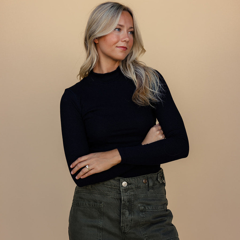The mock neck gives it edge while the textured material makes it stand out. Plus, it’s stretchy and hugs your shape perfectly