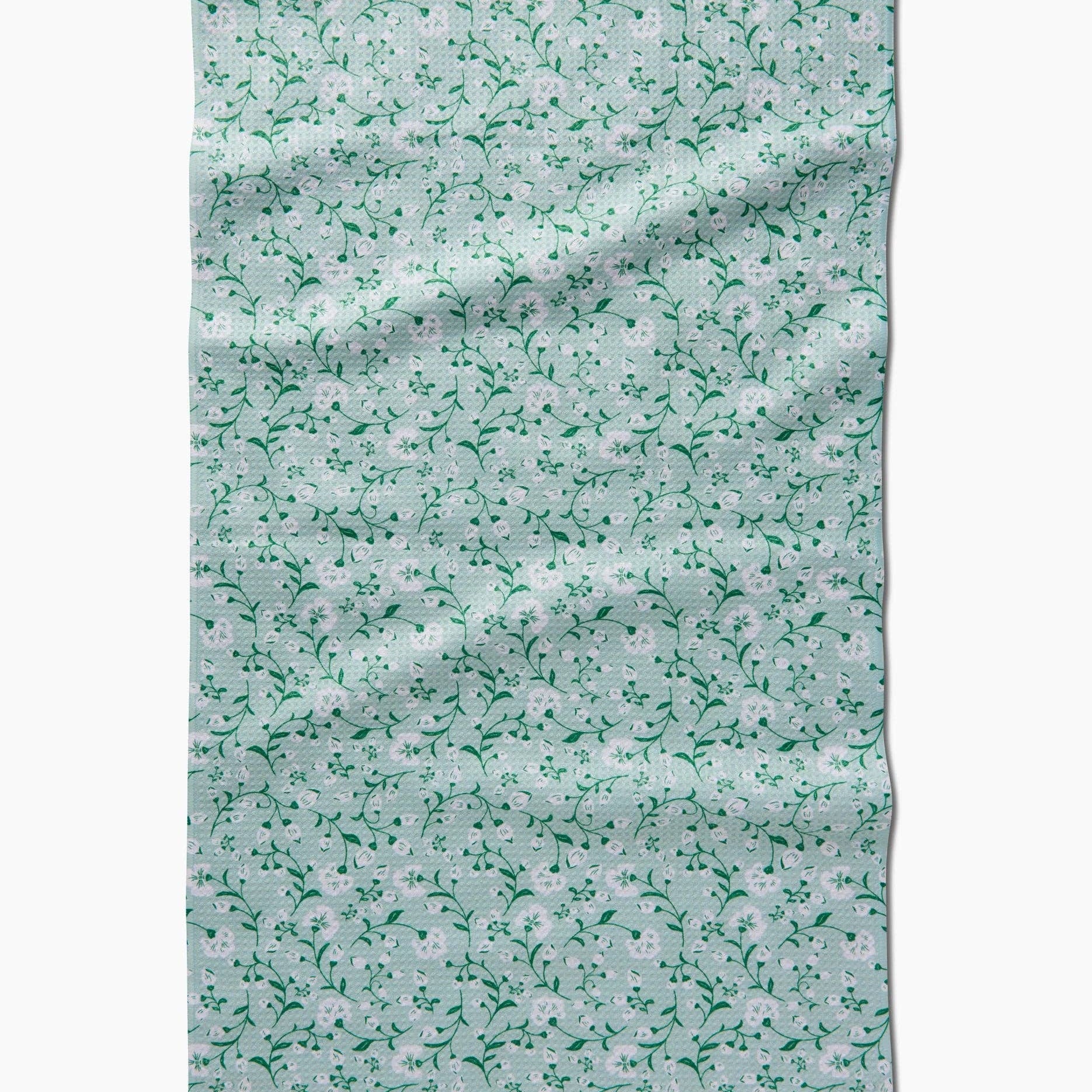 Floral patterned towel on a white background Tea Towel