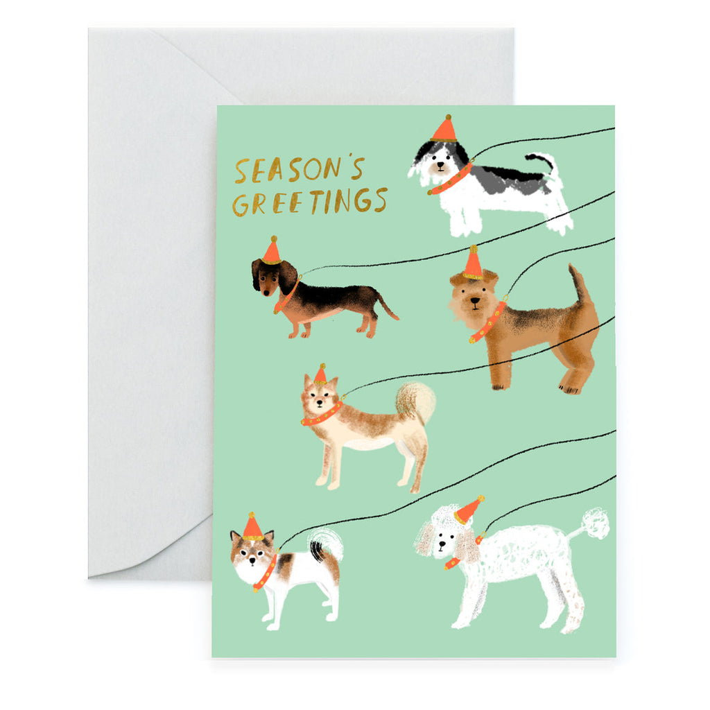 Send your holiday wishes with this adorable card featuring two snow-covered pups out for a winter walk! Perfect for animal-lovers, this cute card is sure to make 'em smile! Let your friends and family know that even in the cold, nothing beats a good ol' dog walk!  Greeting Card, blank inside.  A2 Size -  4.25 by 5.5 inches  Comes with a coordinated envelope and packaged in a clear sleeve.