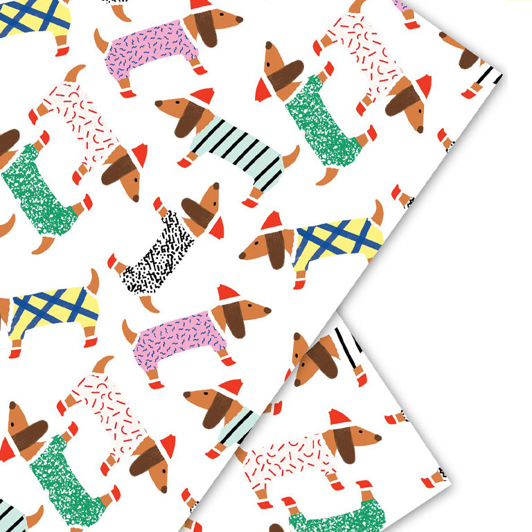 Nothing says winter wonderland like some cute little doxies!   Mid-weight gift wrap with matte finish.   Size  3 Single sheets gift wrap per roll 19.7" x 27.5" per sheet