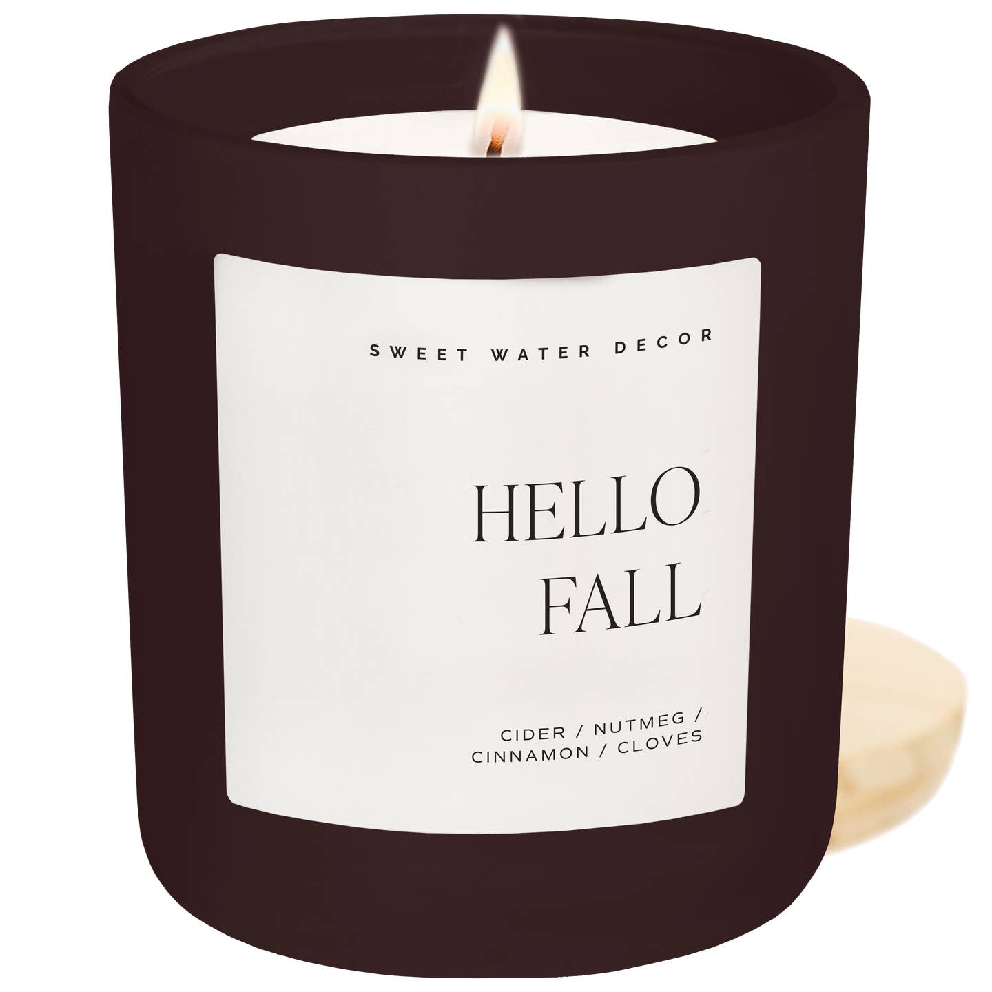 Candle with 'Hello Fall' label and 'Sweet Water Decor' branding on a white background