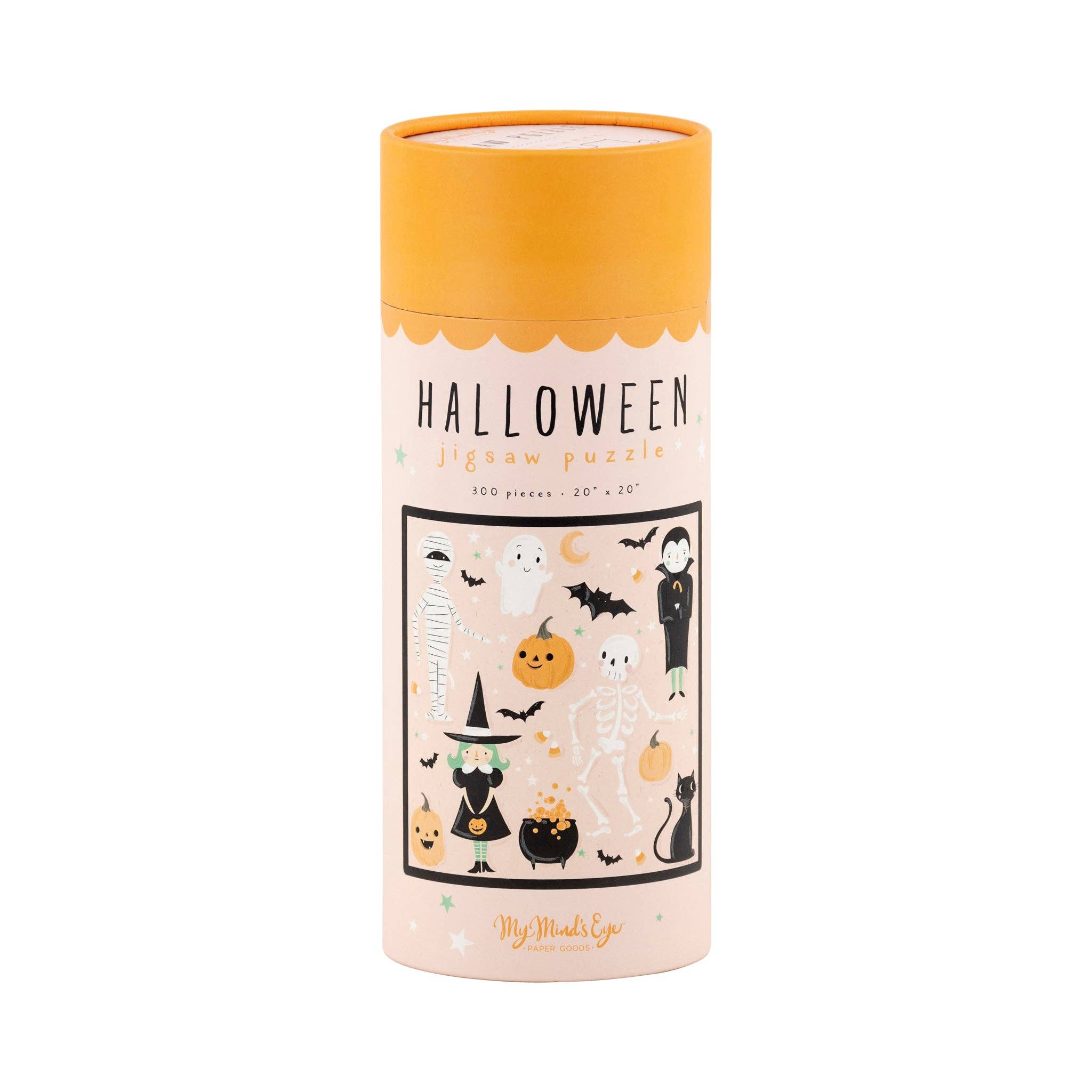 A cylindrical cardboard puzzle box for a Halloween jigsaw puzzle, featuring an orange lid and a pale pink label with a black-bordered illustration of spooky characters, pumpkins, bats, and a witch. 