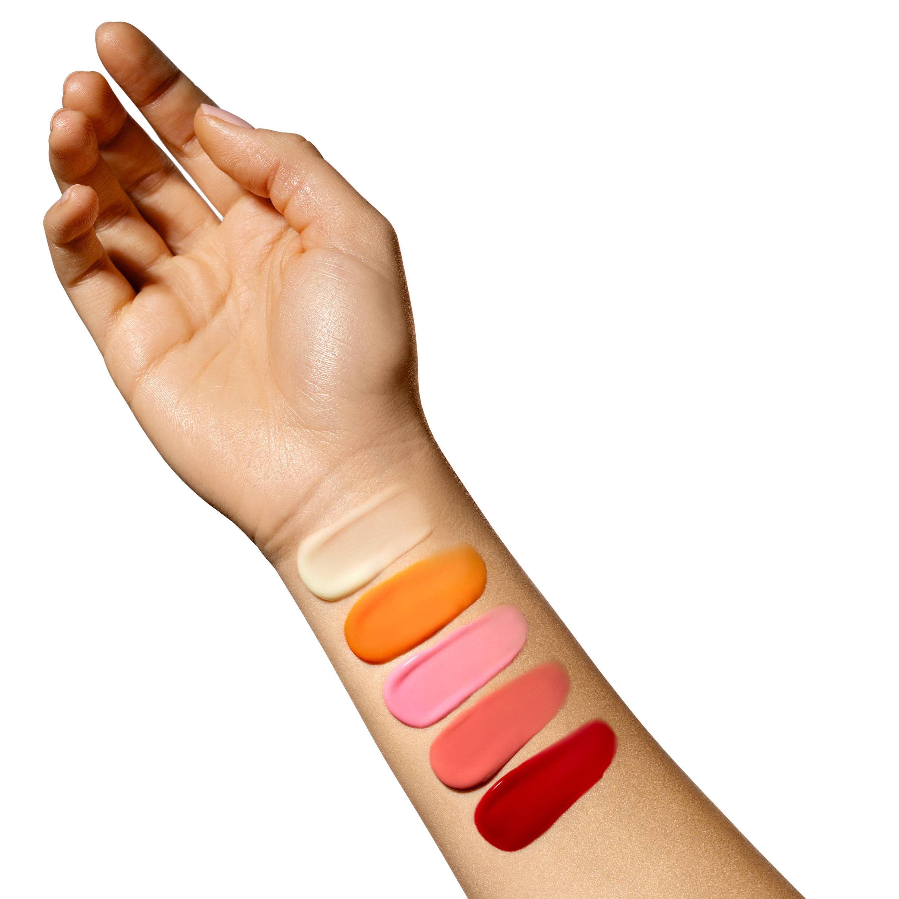 Hand with four different lip color swatches on a white background