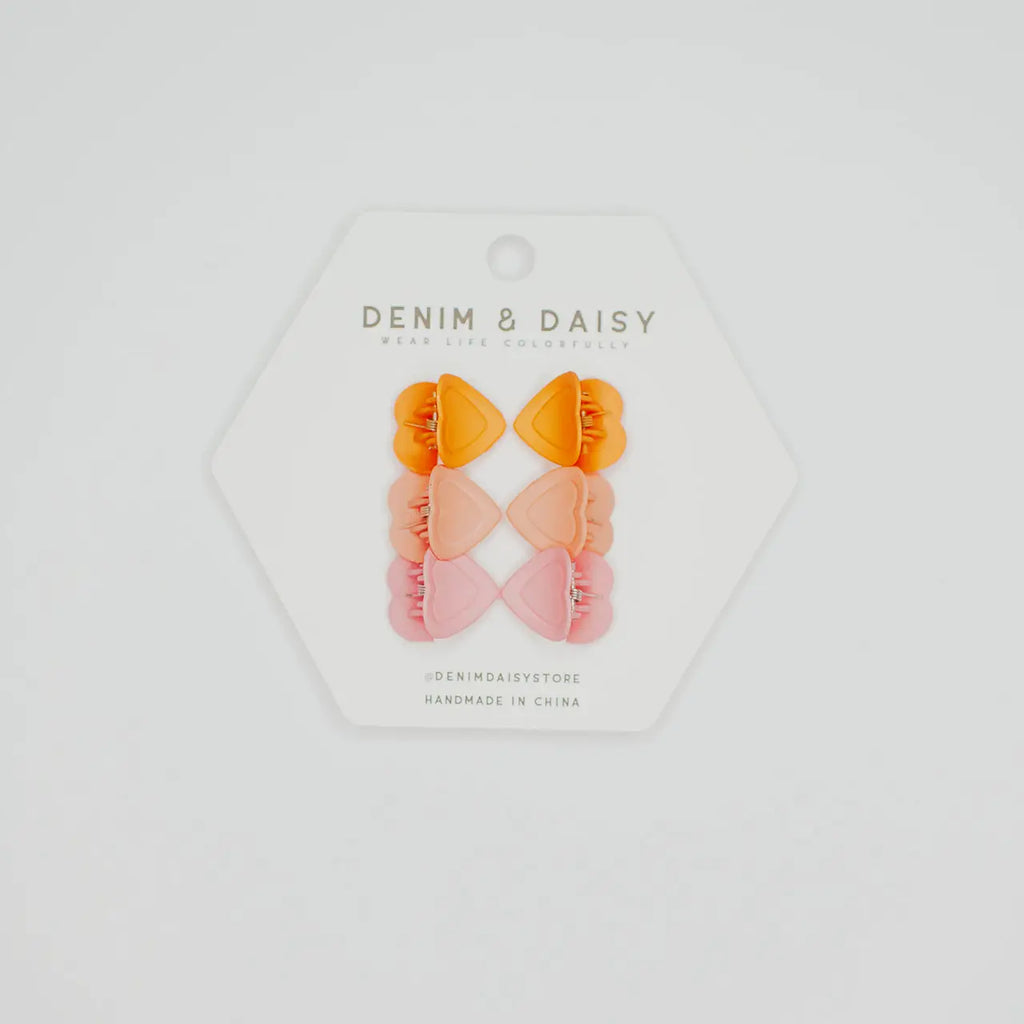 The cutest, tiniest, mini-est, little matte heart hair claws from Denim &amp; Daisy. Each set comes with 3 different colors: Pinks & Orange.