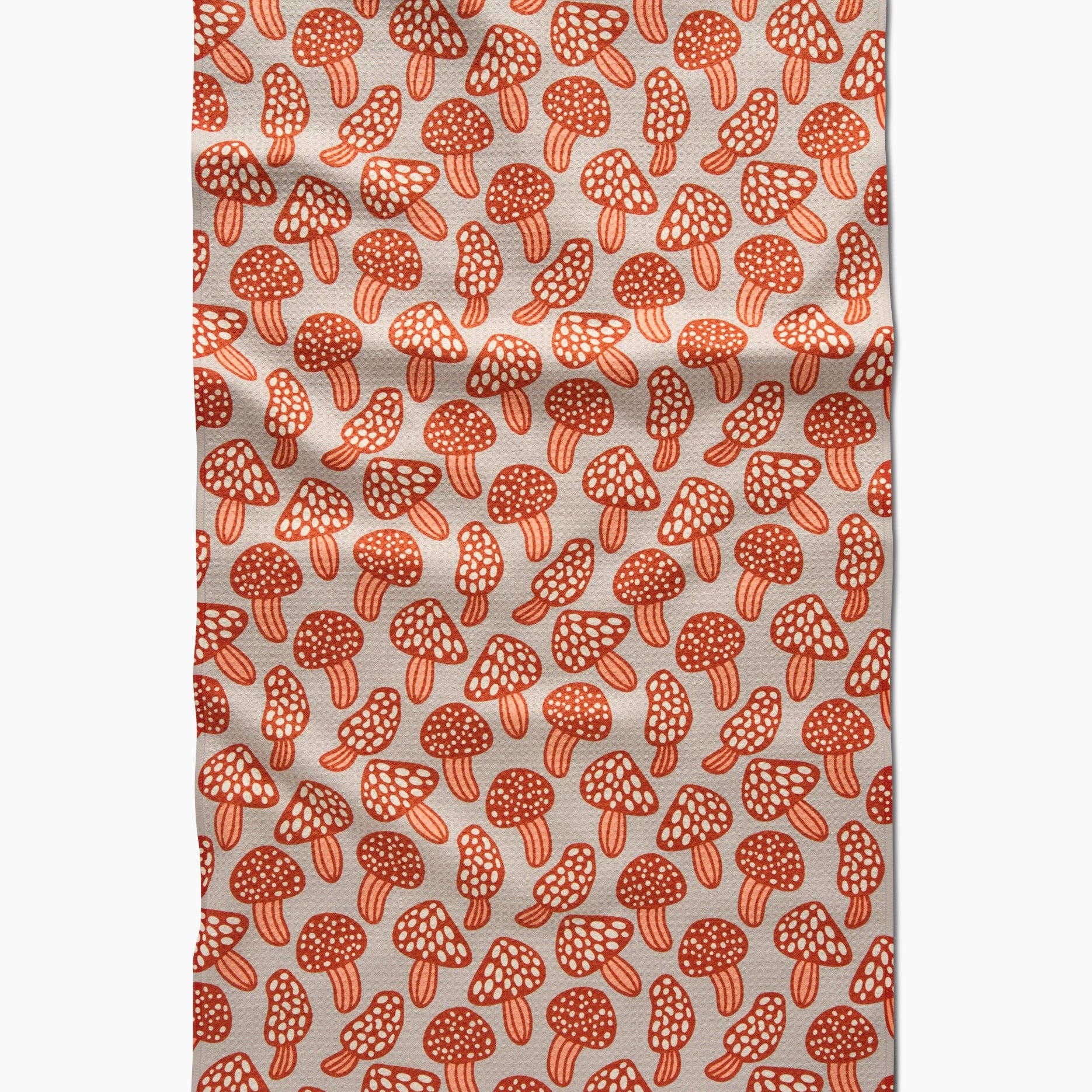 Fabric with red mushroom pattern on a beige background