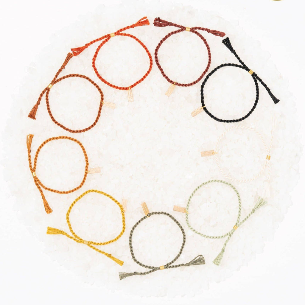 A delicate twist on Twenty Two West's crowd-favorite rope bracelets. The rope is hand spun from a single hue of cotton threads to create this soft and comfortable adjustable bracelet. Wear them individually or collect them all to mix-and-match in a complementary stack! Eucalyptus color.