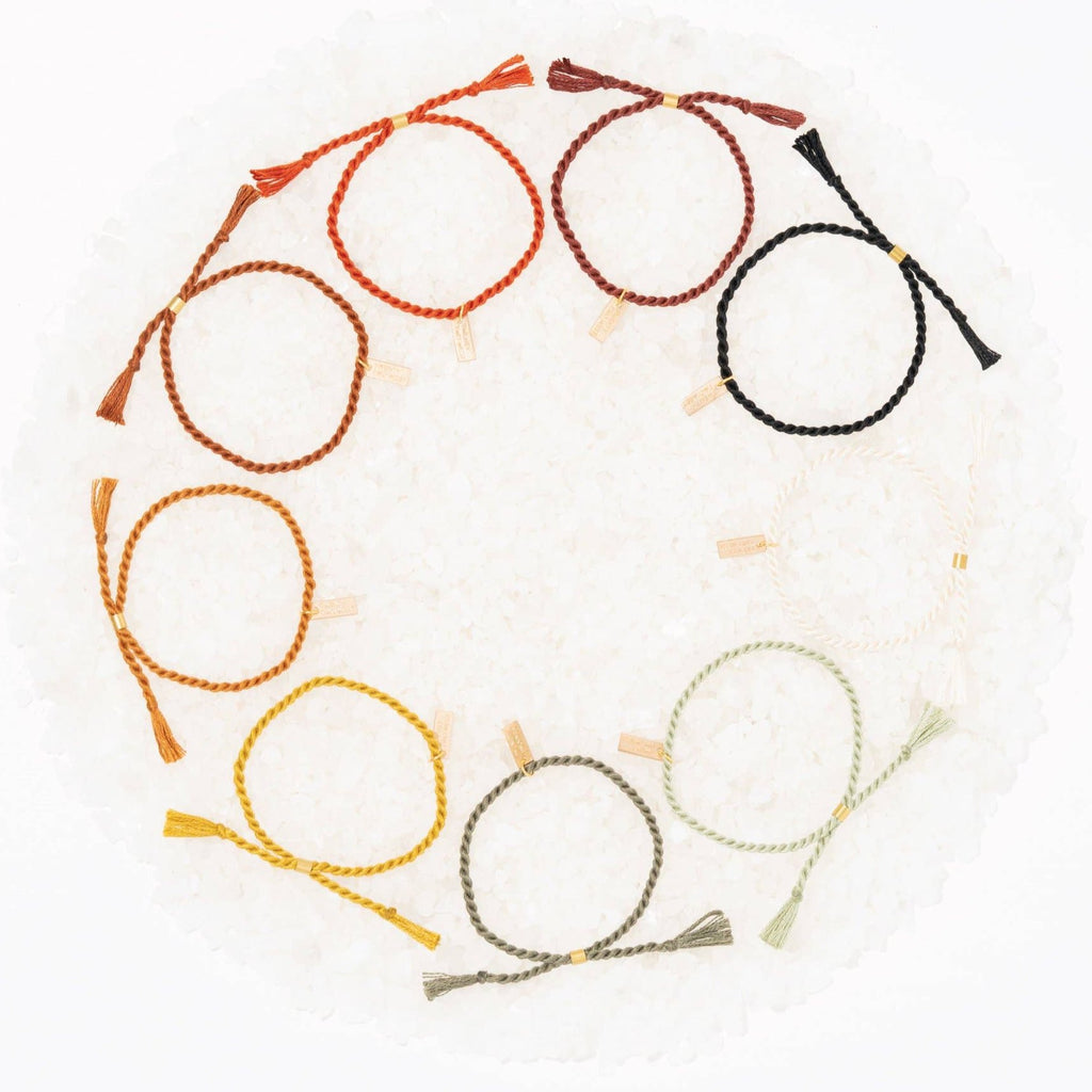 A delicate twist on Twenty Two West's crowd-favorite rope bracelets. The rope is hand spun from a single hue of cotton threads to create this soft and comfortable adjustable bracelet. Wear them individually or collect them all to mix-and-match in a complementary stack! Ink color.