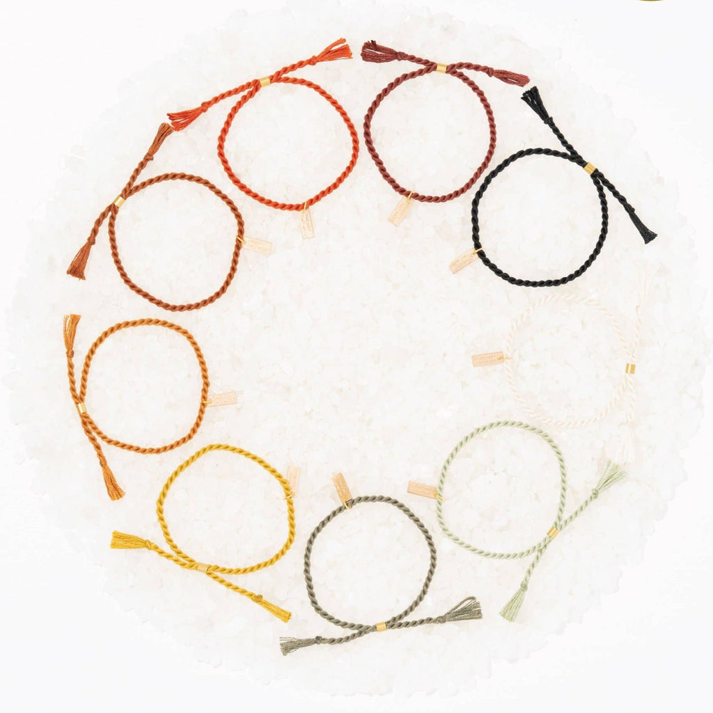 A delicate twist on Twenty Two West's crowd-favorite rope bracelets. The rope is hand spun from a single hue of cotton threads to create this soft and comfortable adjustable bracelet. Wear them individually or collect them all to mix-and-match in a complementary stack! Natural color.