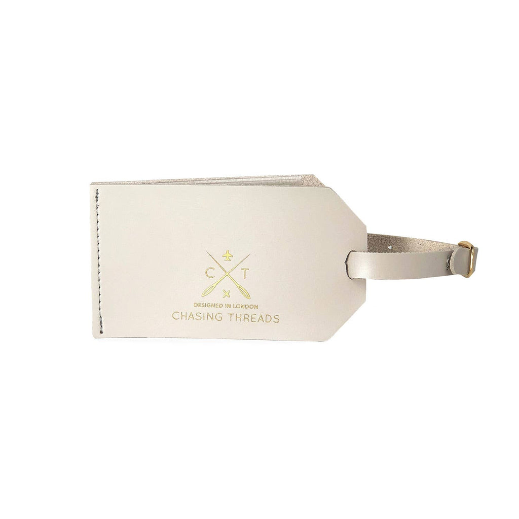 Stitch your own personalised luggage tag! The leather tag is specially perforated so it’s a blank canvas to be cross-stitched with a unique design. It comes with ‘travel’ needle, 2 color threads &amp; a template of letters. Stitch with initials, country flag or bespoke design to create a personalised label. Simply remove the strap to stitch the cover, and pop in your business card or contact information into the clear pouch inside. All tags are real leather - apart from the vegan Light Grey.