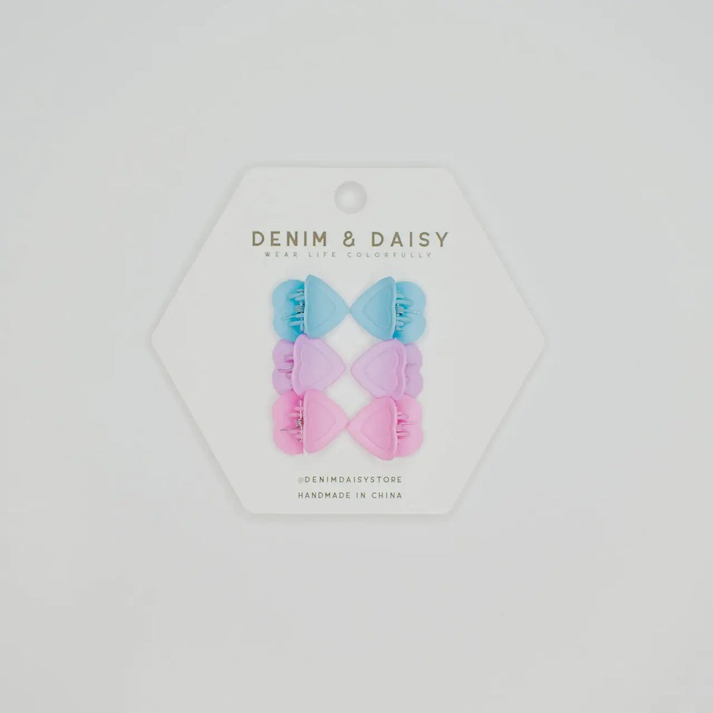 The cutest, tiniest, mini-est, little matte heart hair claws from Denim &amp; Daisy. Each set comes with 3 different colors: Blue, Purple and Pink