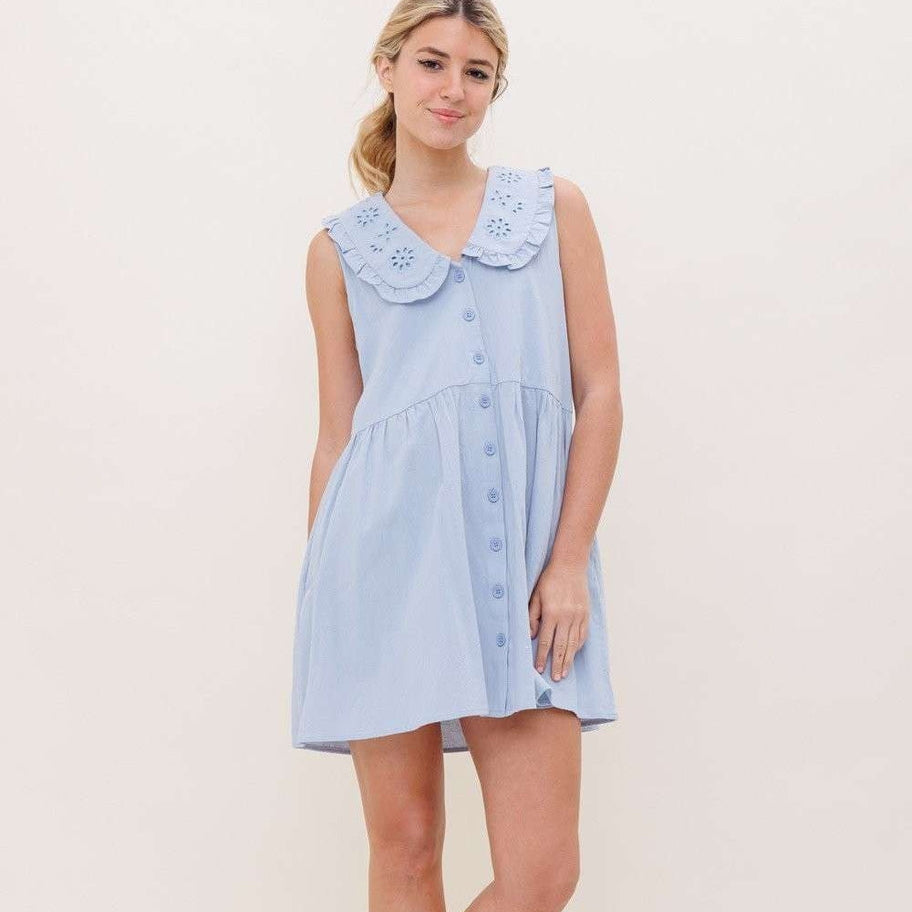 Dazzle in this charming blue mini dress featuring buttons and pockets. Convenient and stylish, this dress is perfect for any occasion. Lighten up your wardrobe with this playful piece 