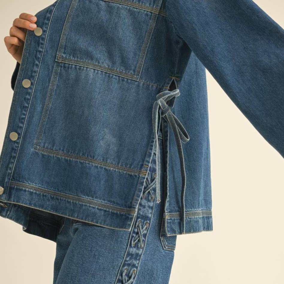 Get ready to tie up your style game with our Tied On the Side Denim Jacket! With its unique design, this jacket adds a touch of playful charm to any outfit. Made with high-quality denim, it's both stylish and durable. Say goodbye to boring jackets and hello to a fun and fresh look!