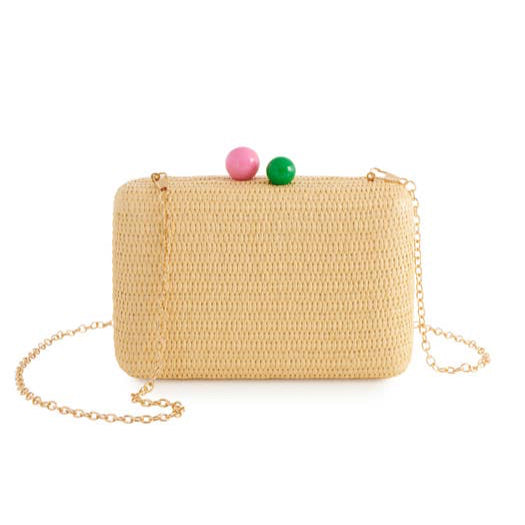 Meet the June Minaudière, your new go-to bag for playful elegance. With its compact silhouette, natural hue, and eye-catching color-pop clasp, this piece adds instant fun to any outfit. Handwoven with precision, it’s both lightweight and luxurious, featuring a detachable chain for effortless wear. Whether tucked under your arm or slung casually over your shoulder, the June Minaudière is the statement accessory you never knew you needed.