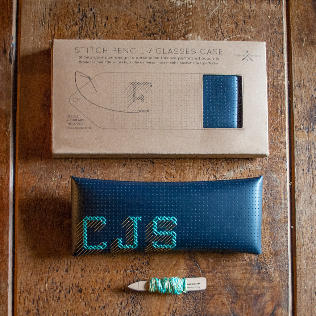 Stitch your own way - this envelope pocket is ideal as a pencil or glasses case and allows you to sew any unique design. Whether you stitch initials, a slogan or the sunglasses template included, it opens out fully for easy stitching. It also opens 2 ways, so it can open from the side or from the top - just pop the metal buttons to fold up whichever way you prefer. The Navy pouch comes with teal & gold thread &amp; needle wrapped on our pen thread-board. It includes our 3D alphabet template to add initials