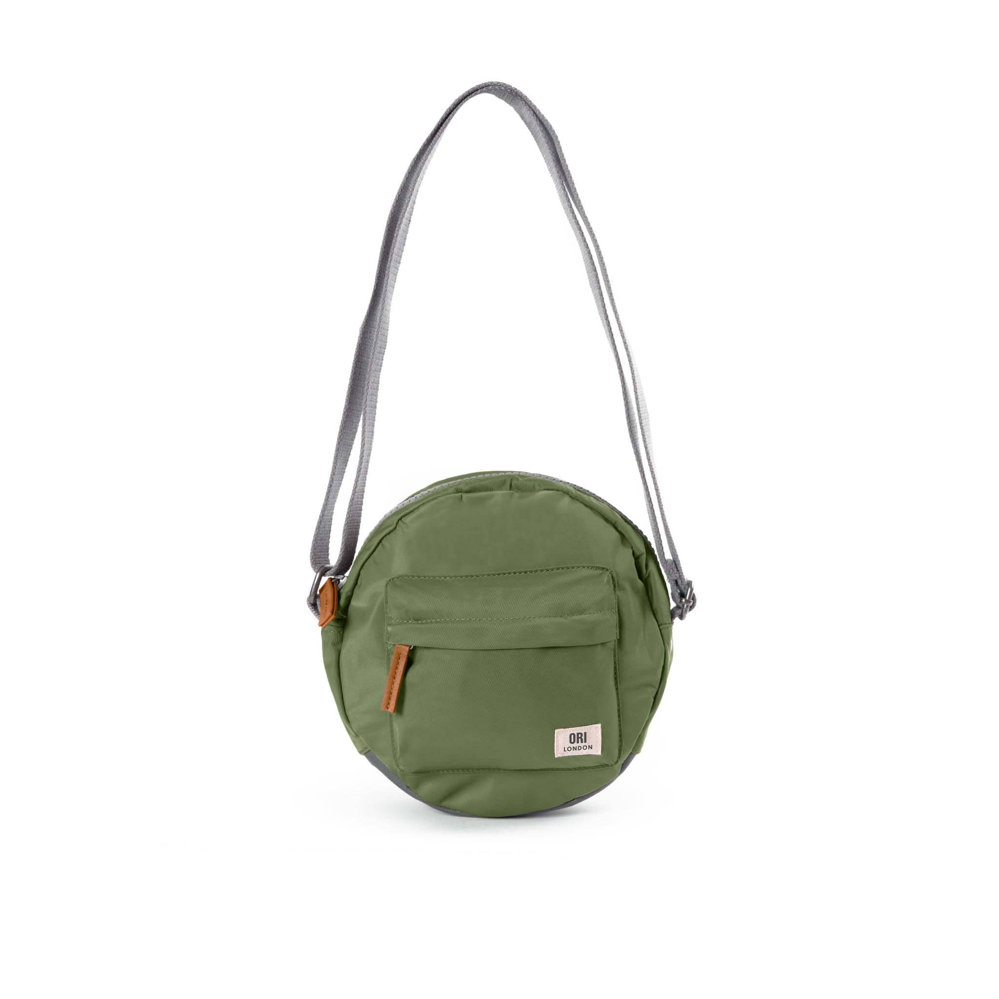 Over the shoulder and crosstown, our Paddington Crossbody is the perfect round bag to sling across your body and take on your day. Avocado COLOR

The Paddington bag has three pockets and sections to keep everything organized, safe and secure, all in weather-resistant, recycled material.

The size is the perfect accessory to store all your daily necessities - mobile, wallet, keys, and more! Our Paddington Crossbody is the only, stylish round bag out there.