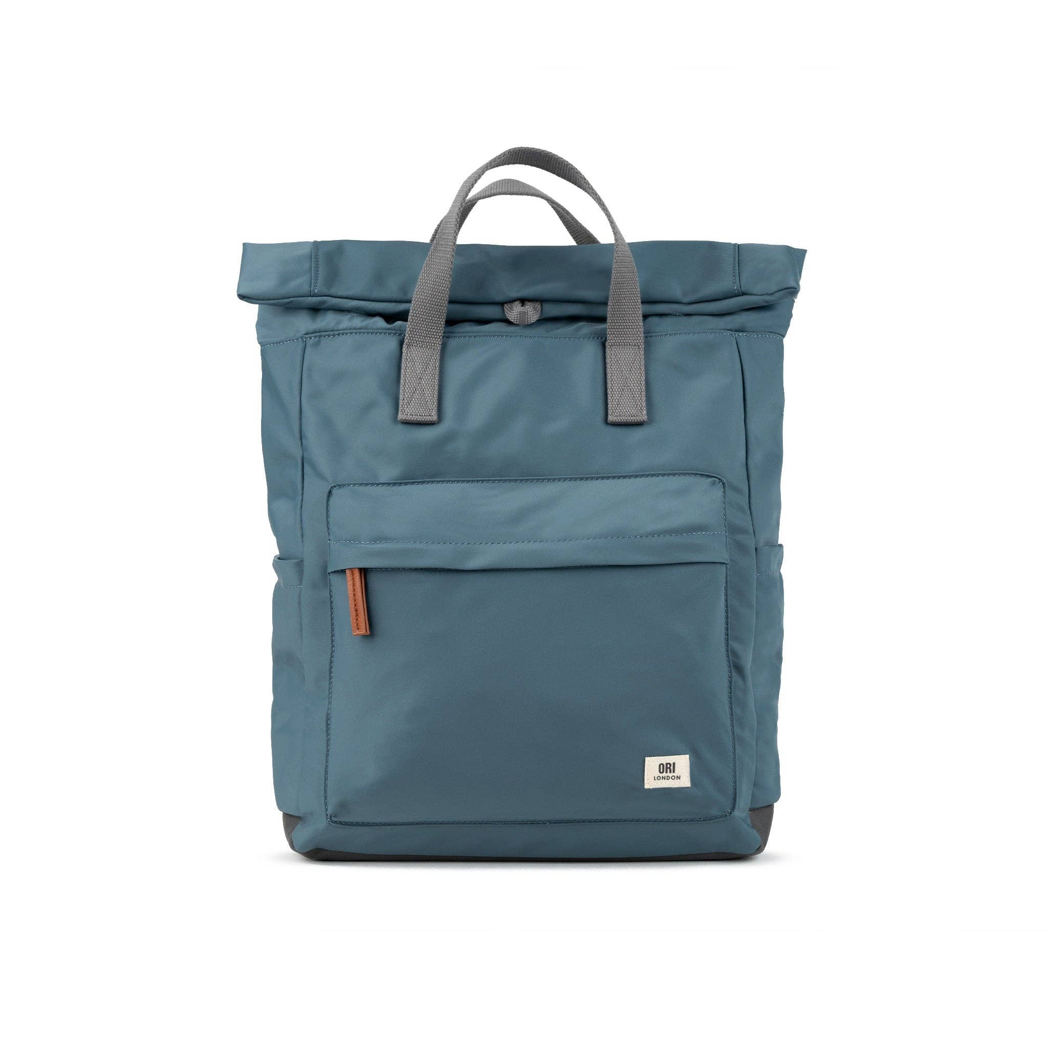 Blue backpack with gray straps on a white background