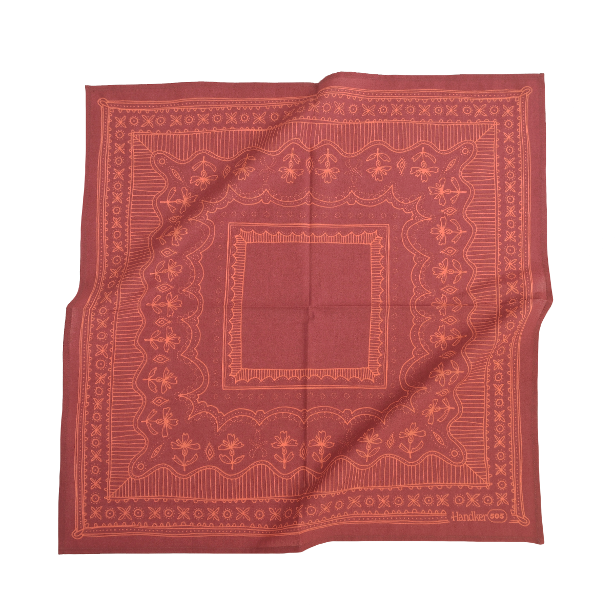 Red bandana with intricate patterns on a white background