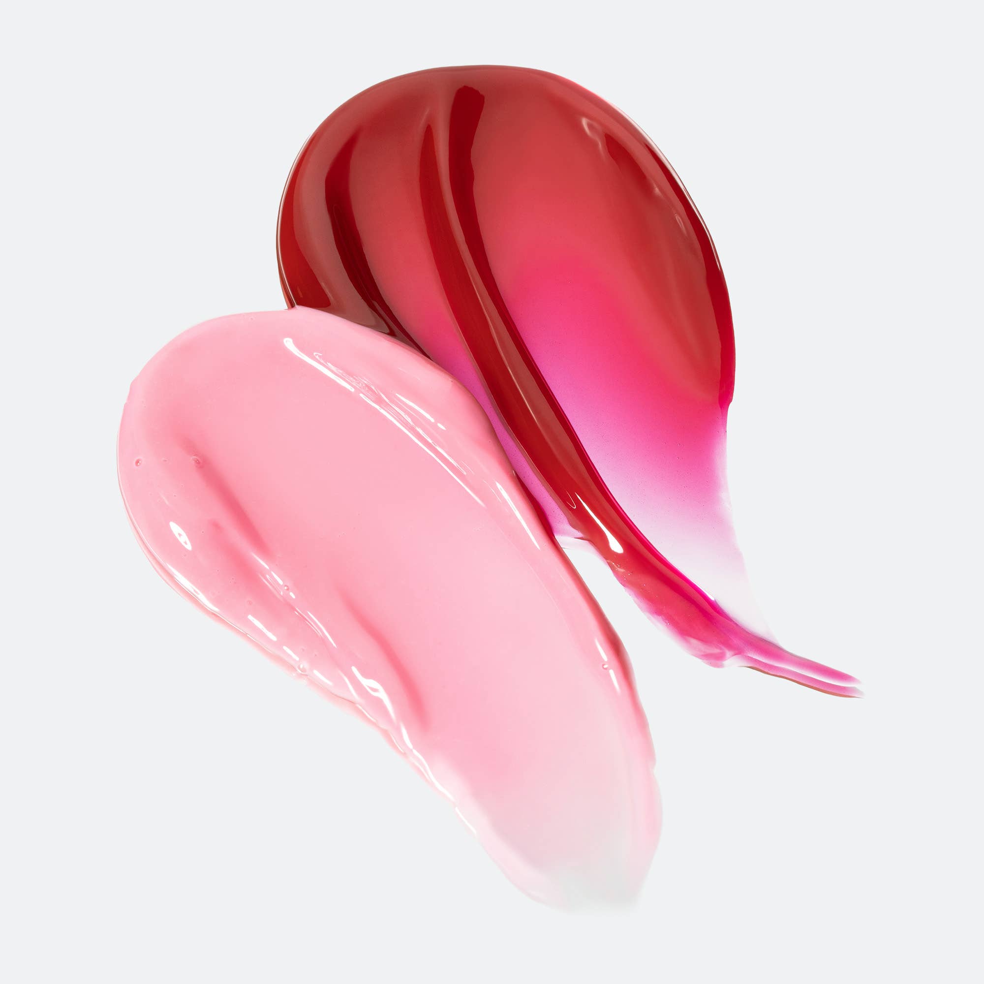 Pink and red lip gloss swatches on a light gray background