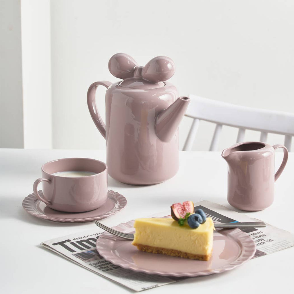 The tea set is available as a 6 piece deluxe porcelain tea set. This set features a simple all solid color design, with each piece made from porcelain. This set is sure to be a hit at your next family gathering, holiday, or just because.  All pieces are dishwasher and microwave safe.