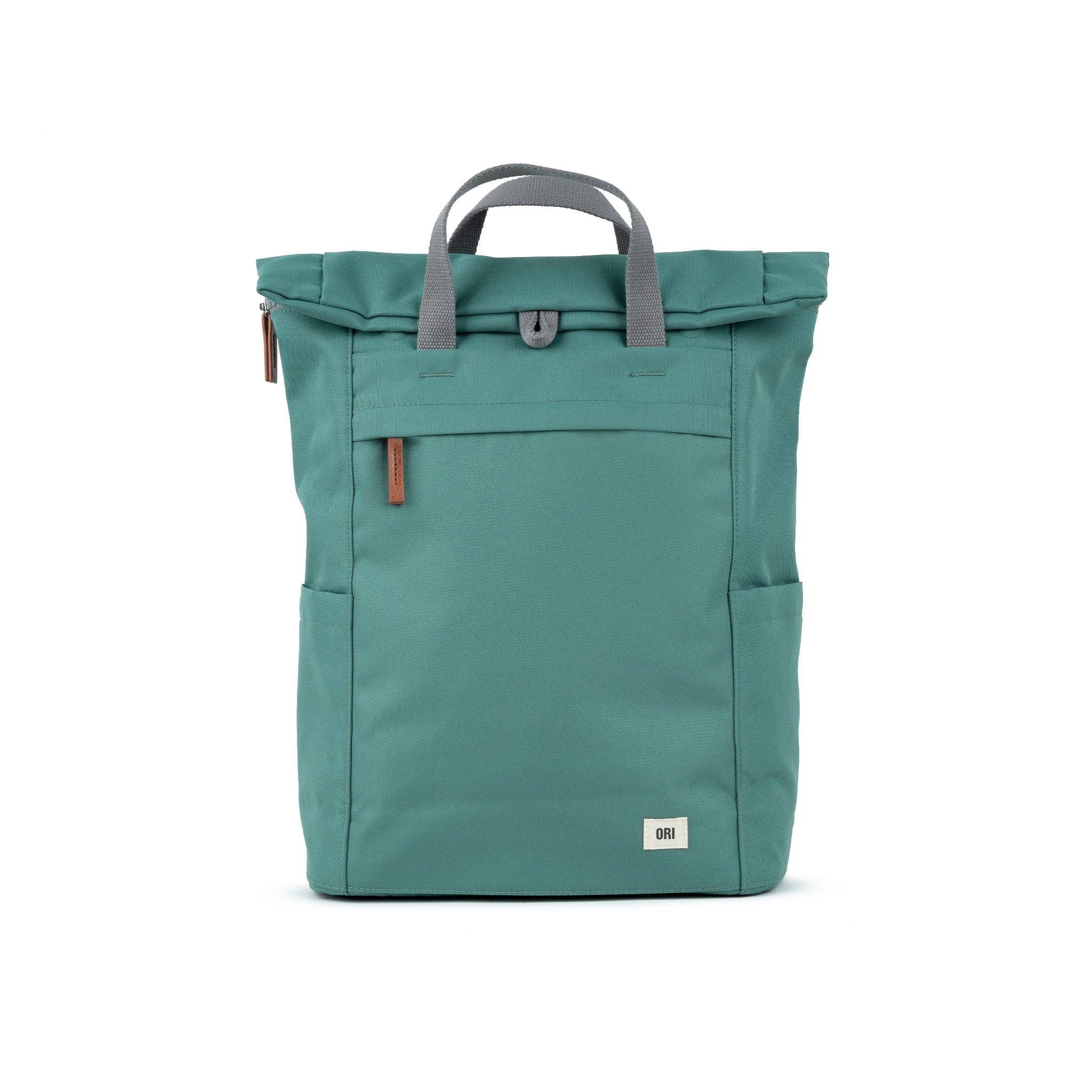 Rock the outdoor look with our minimalist-design, roll-top backpack with a large front pocket with a chunky zip. Sage&nbsp;

This weather-resistant bag has extra storage space, a padded laptop or tablet sleeve and loads of pockets. Made using recycled Canvas made from plastic waste and coated to make it water-resistant, our canvas material is weather-resistant, lightweight, and as durable as all our ORI London bags.
