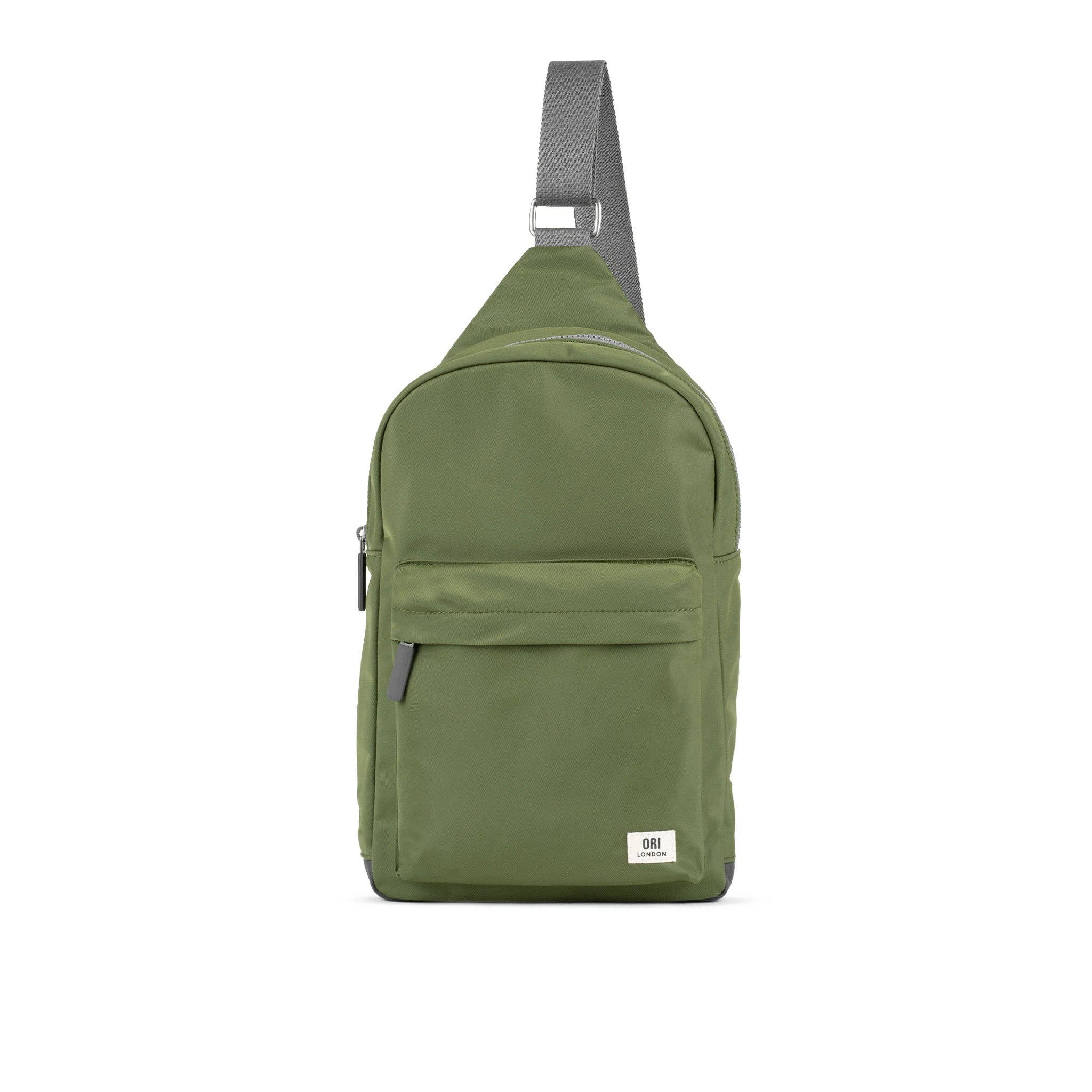 Sling on and hit the road with our brand new extra large Willesden sling bag that now fits in a 13 to 15-inch laptop!

Made using recycled material, the Willesden bag is the crossbody bag you've been looking for. With a front zip pocket on the outside and an organizational panel inside, you'll have everything you need right where you need it! There’s also a secret pocket on the back which means you can be on the go – worry-free and hands-free! Avocado green.