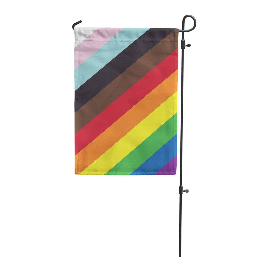 The 11-Stripe Diagonal Pride Flag by Flags For Good turned into a cute vertical garden flag with standard pole pocket along the top. Flags for good took the traditional 6-Stripe Rainbow flag popularized by Gilbert Baker, added the black and brown stripes from the Philadelphia Pride Flag, and then topped it with the turquoise, pink, and white from the Trans Pride Flag and turned them 45 degrees to make a beautiful new diagonal pride flag! 18" x 12"
