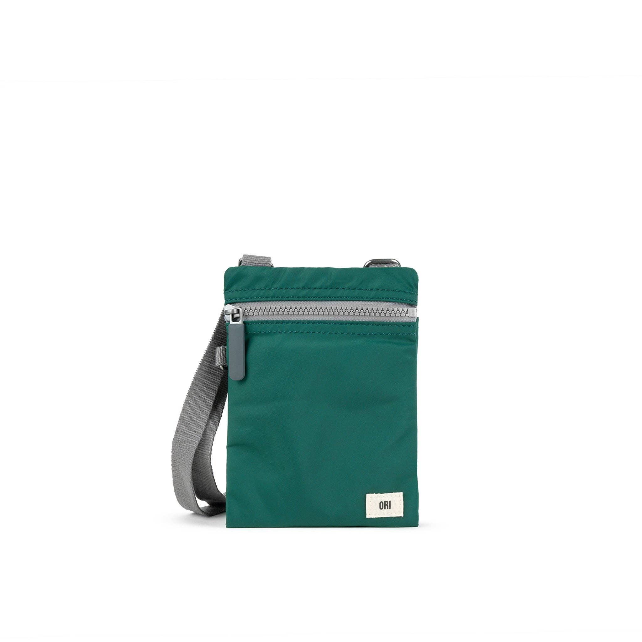 Our hands-free extra pocket is always by your side. The Chelsea is our great little crossbody pocket to keep those special things close and safe. Teal

Give your phone, card and essentials their very own stylish way to be carried whilst you are on the move. Our brand-new Chelsea collection is the perfect lightweight, urban accessory for you to travel light and always be on the move.

Made from recycled material, the Chelsea has been designed to keep your mobile phone, cards, and valuables close by.