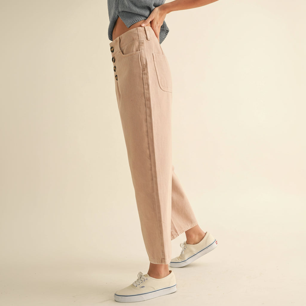 Classic cotton pants with a refined button front detail. Crafted from soft, breathable cotton for everyday comfort and versatility. The tailored fit flatters while allowing ease of movement, making these pants perfect for casual outings or dressed-up occasions. Available in a sophisticated mauve tone that pairs effortlessly with any wardrobe staple.
