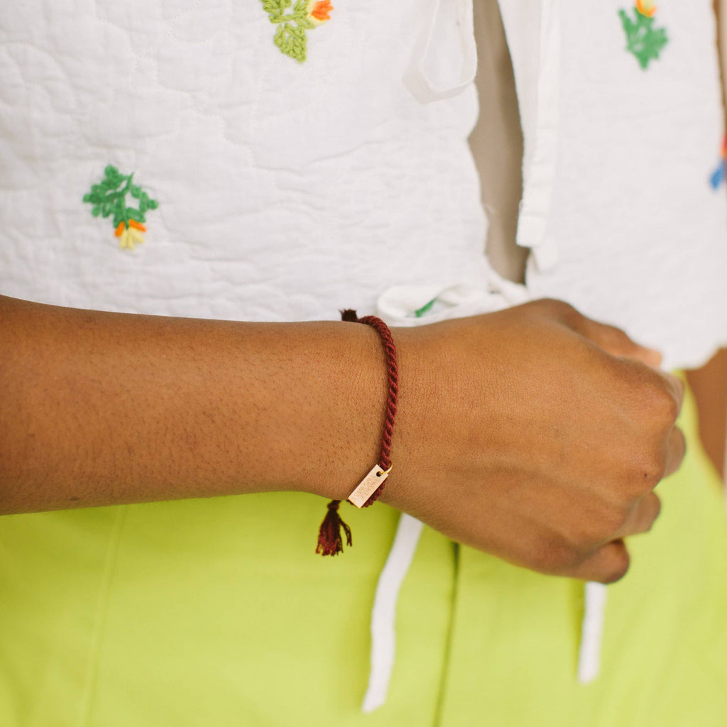 A delicate twist on Twenty Two West's crowd-favorite rope bracelets. The rope is hand spun from a single hue of cotton threads to create this soft and comfortable adjustable bracelet. Wear them individually or collect them all to mix-and-match in a complementary stack! Autumn color.