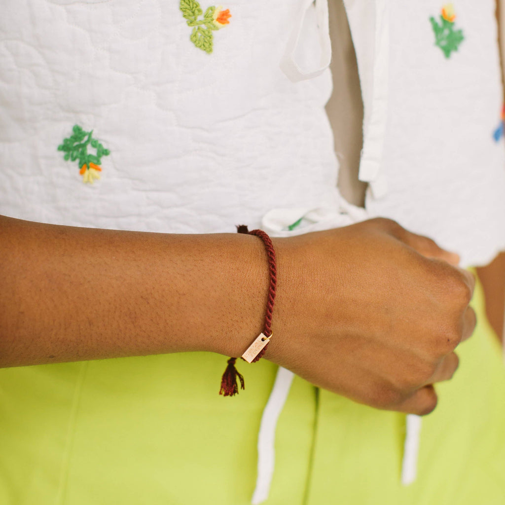A delicate twist on Twenty Two West's crowd-favorite rope bracelets. The rope is hand spun from a single hue of cotton threads to create this soft and comfortable adjustable bracelet. Wear them individually or collect them all to mix-and-match in a complementary stack! Ink color.