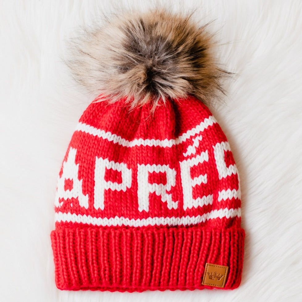 Stay warm in style with our red & cream aprés pom hat! Handcrafted from 100% acrylic, the Apres knit hat is super soft to the touch and features a luxurious faux fur pom on top – giving you a touch of luxury without the hefty price tag. Get ready to embrace winter in cozy chic!  Material  100% acrylic