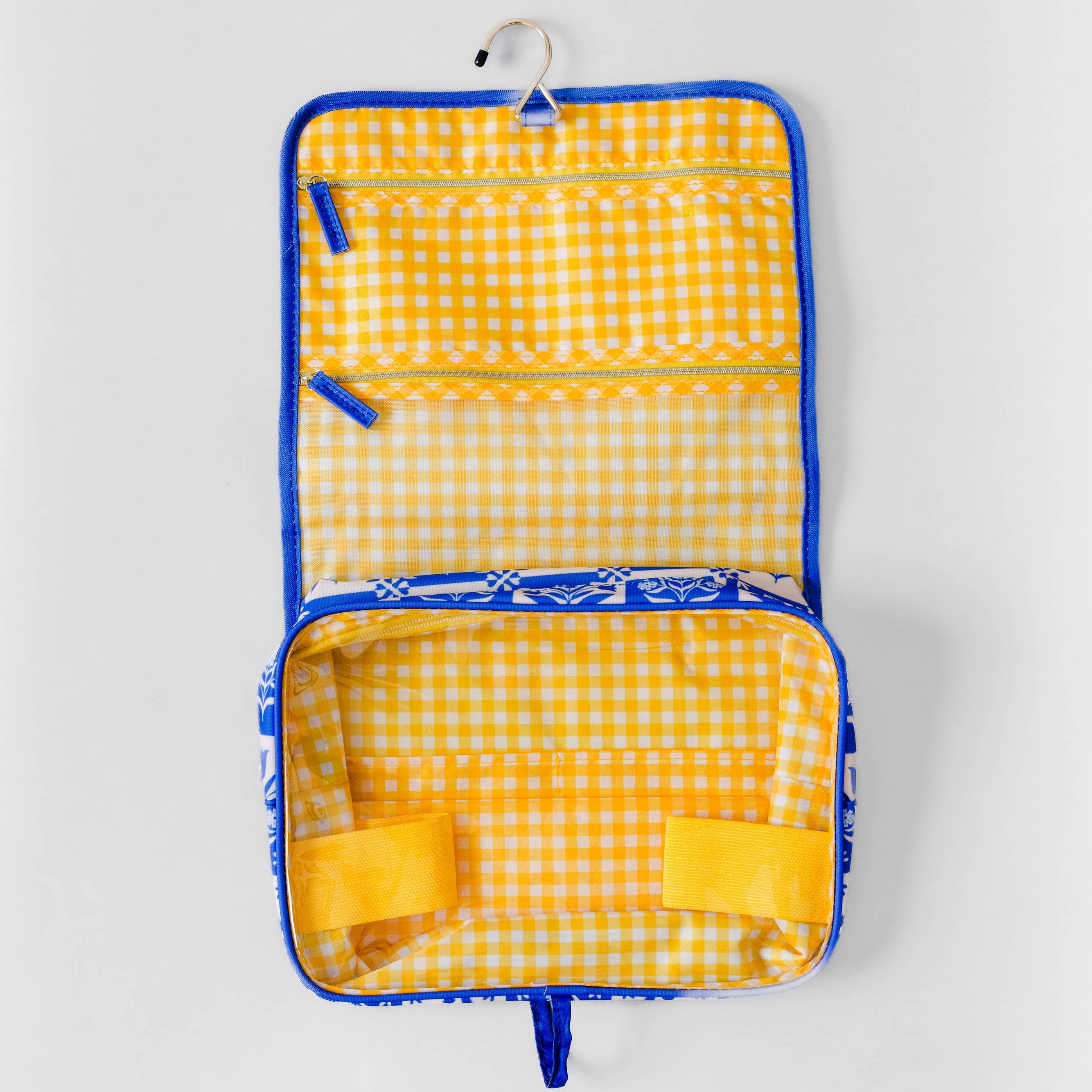 A yellow and white gingham checked hanging organizer pouch with blue trim, shown open against a light gray background.