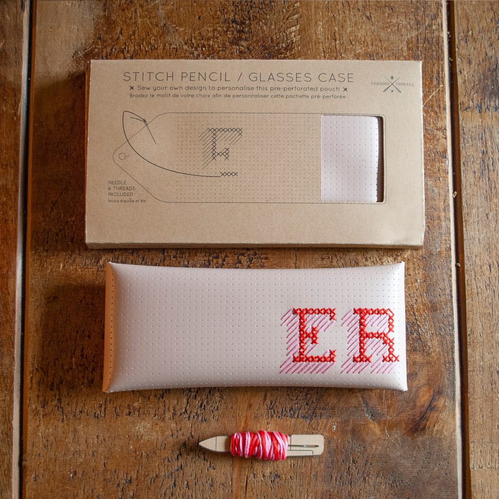 Stitch your own way - this envelope pocket is ideal as a pencil or glasses case and allows you to sew any unique design. Whether you stitch initials, a slogan or the sunglasses template included, it opens out fully for easy stitching. It also opens 2 ways, so it can open from the side or from the top - just pop the metal buttons to fold up whichever way you prefer. The Navy pouch comes with teal & gold thread &amp; needle wrapped on our pen thread-board. It includes our 3D alphabet template to add initials