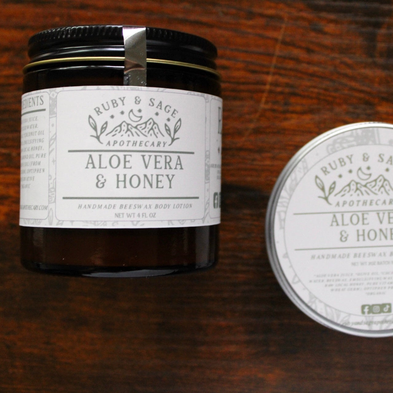 Jar and tin of Ruby & Sage Aloe Vera & Honey product on a wooden surface