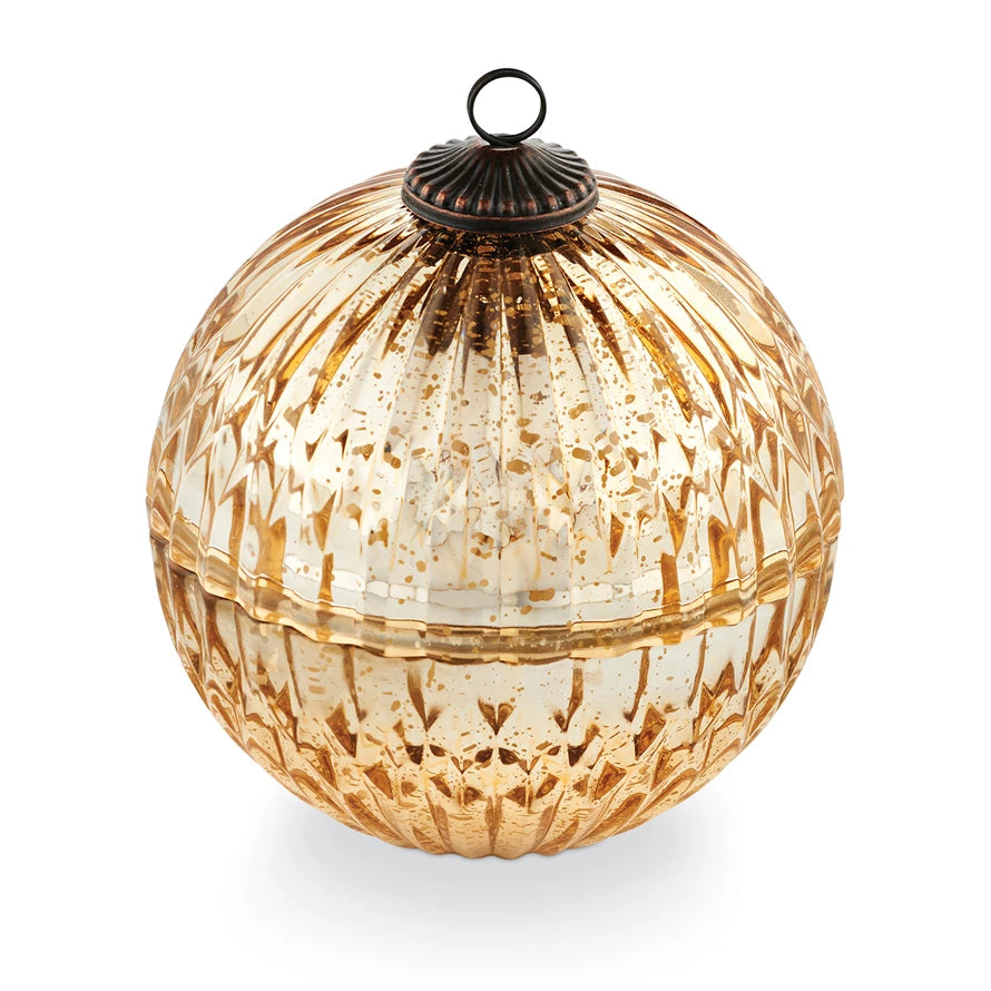 Decorative glass ball with textured surface on a white background