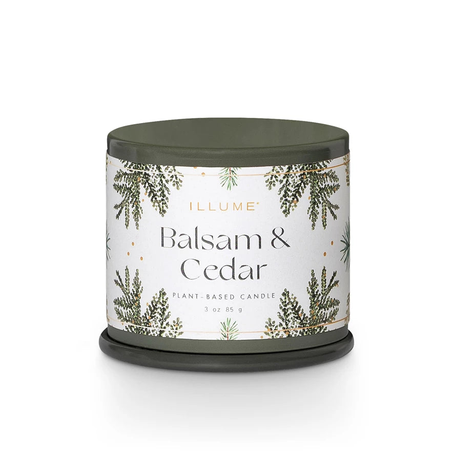 Candle with 'Balsam & Cedar' label on a white background