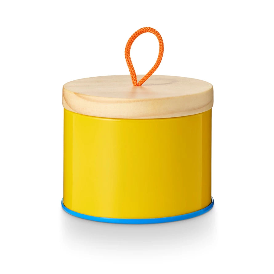 Pool Floatie Sun Tin Candle. Yellow with blue trim