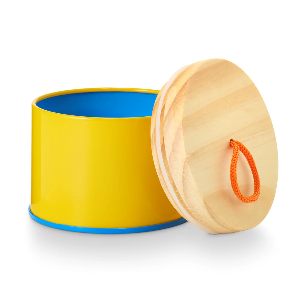 Pool Floatie Sun Tin Candle. Yellow with blue trim