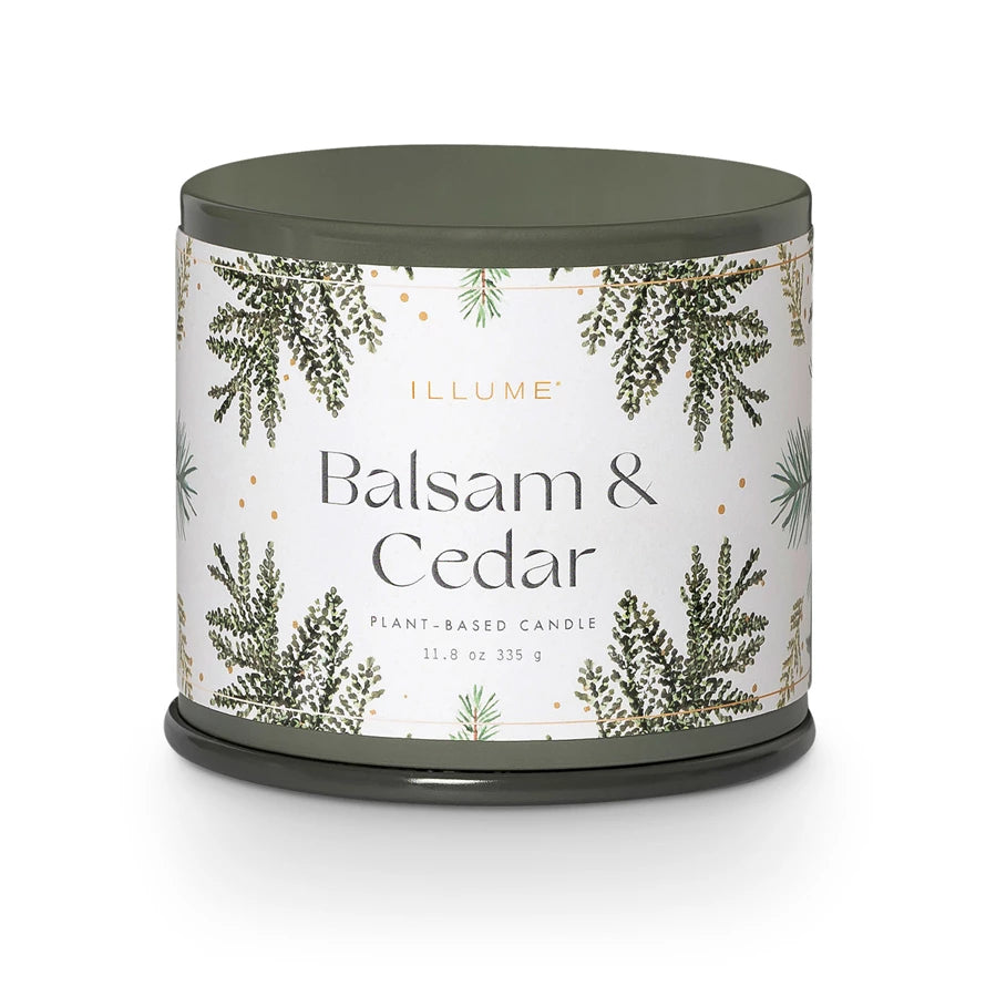 Candle with 'Balsam & Cedar' label on a white background