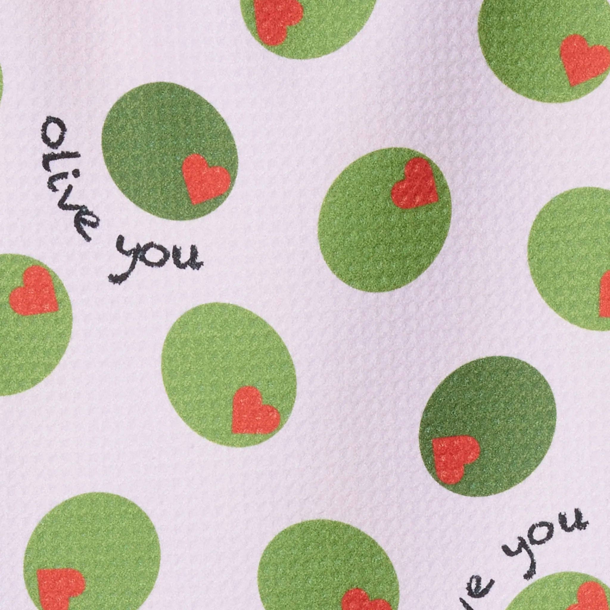 Pattern of green circles with red hearts and text on a white background tea towel