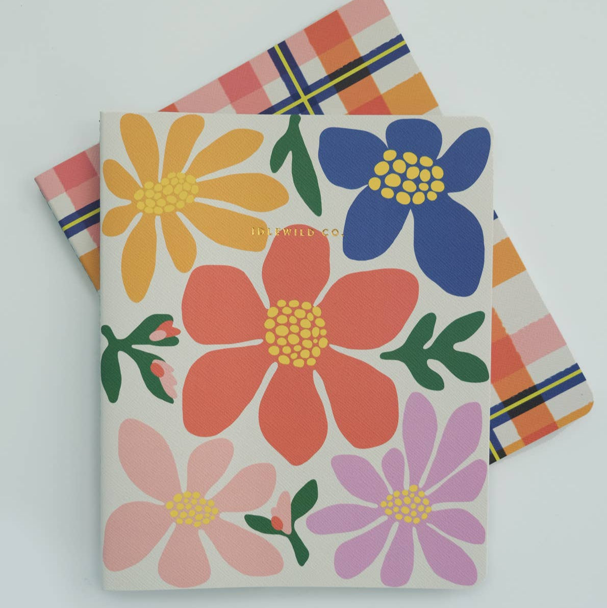 Notebook with colorful floral design on a white background