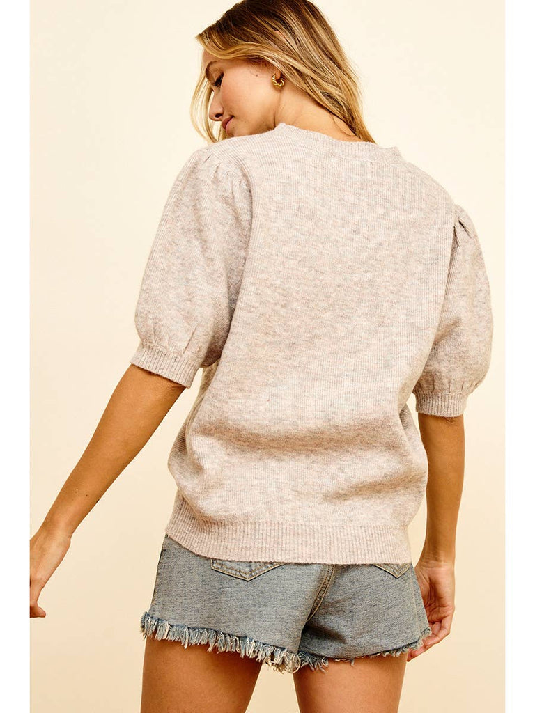 Get cozy, cute and a little bit quirky with this Taupe Puff Sleeve Cropped Sweater. The unique puff sleeves add a fun twist to this classic cropped style, making it a must-have for your wardrobe. Perfect for layering or wearing solo, this sweater is bound to become your new go-to piece.