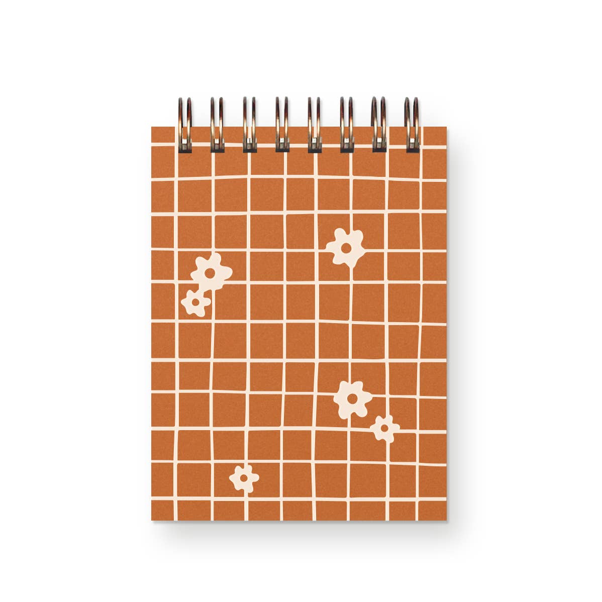 Notebook with orange grid pattern and white floral designs on a white background