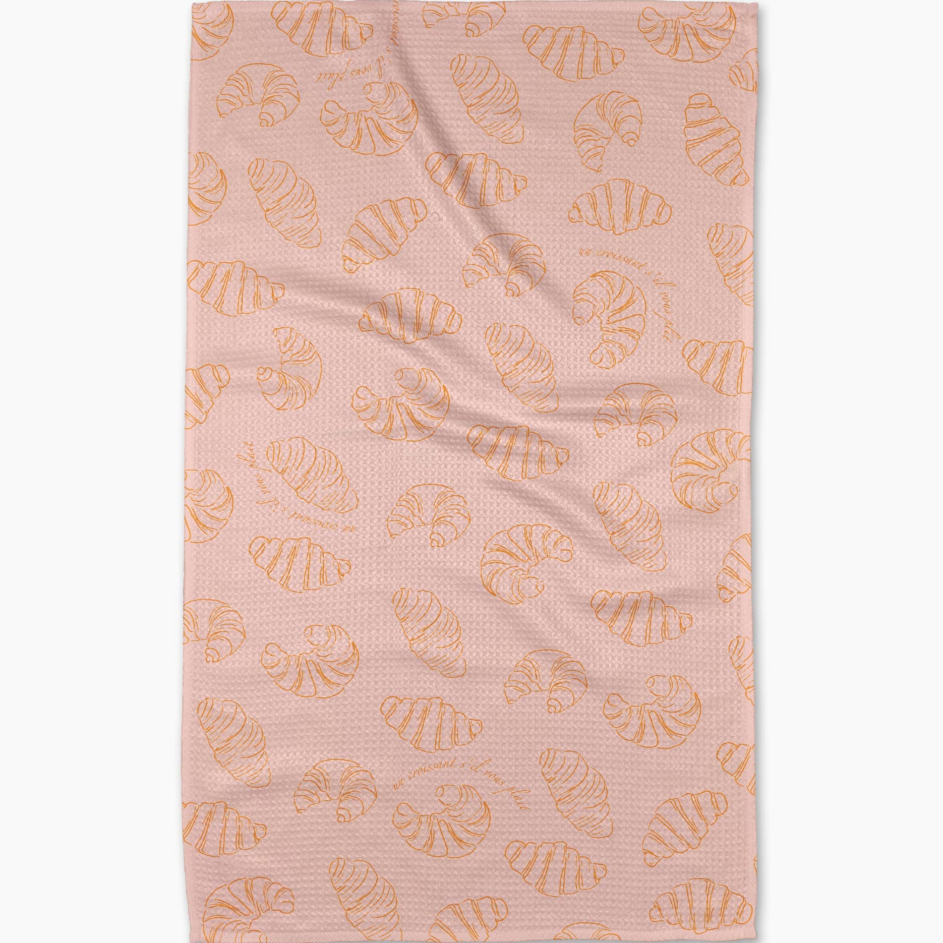 Pink towel with croissant pattern on a white background