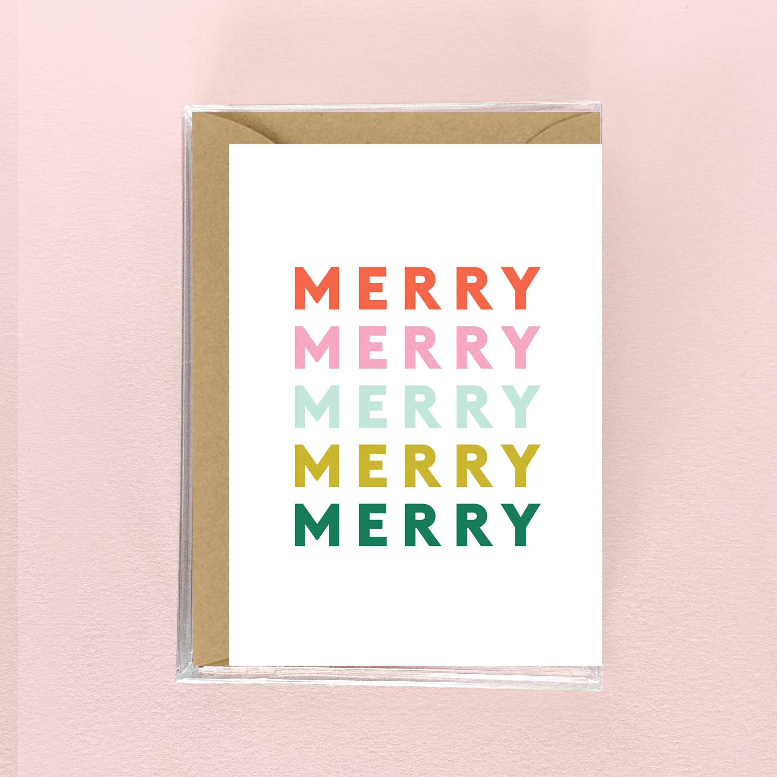 Greeting card with 'MERRY' text in different colors on a pink background