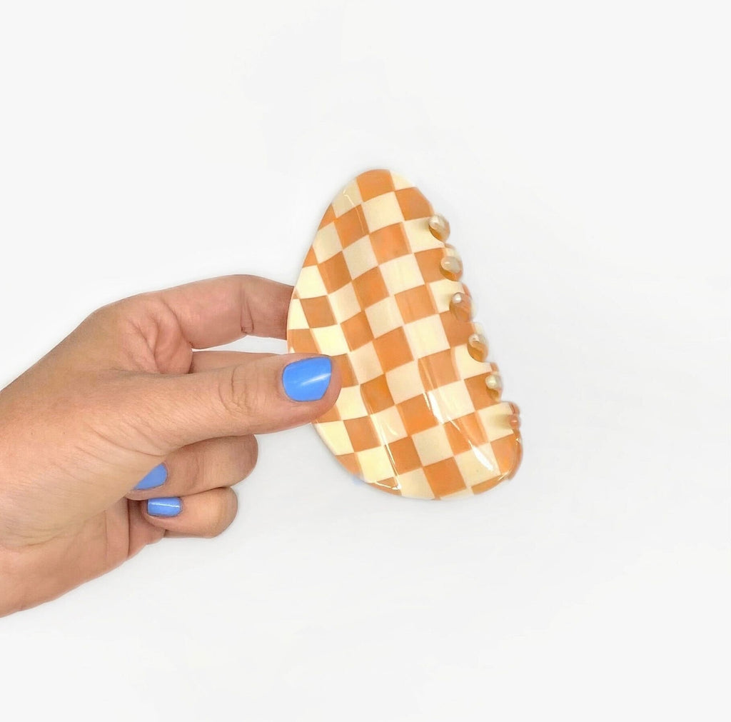 Make a statement with our Checker Claw in Frose! Our on-trend checker patterned hair claw will hold your locks in place with a touch of fashion flare. Perfect for adding a subtle but stylish twist to any look. So go ahead and claw your way to stunning tresses!