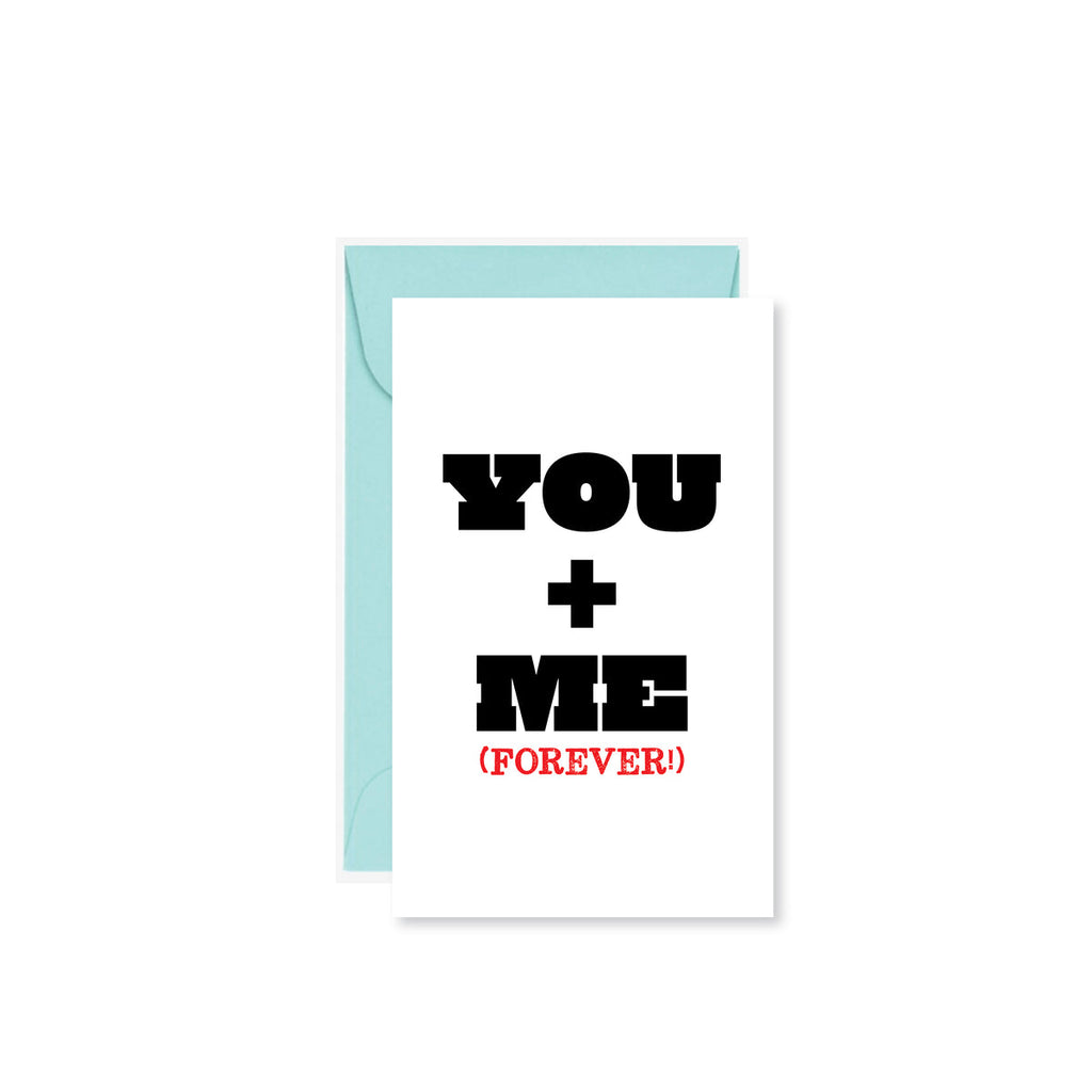 white mini card reading "You + Me (Forever)"
