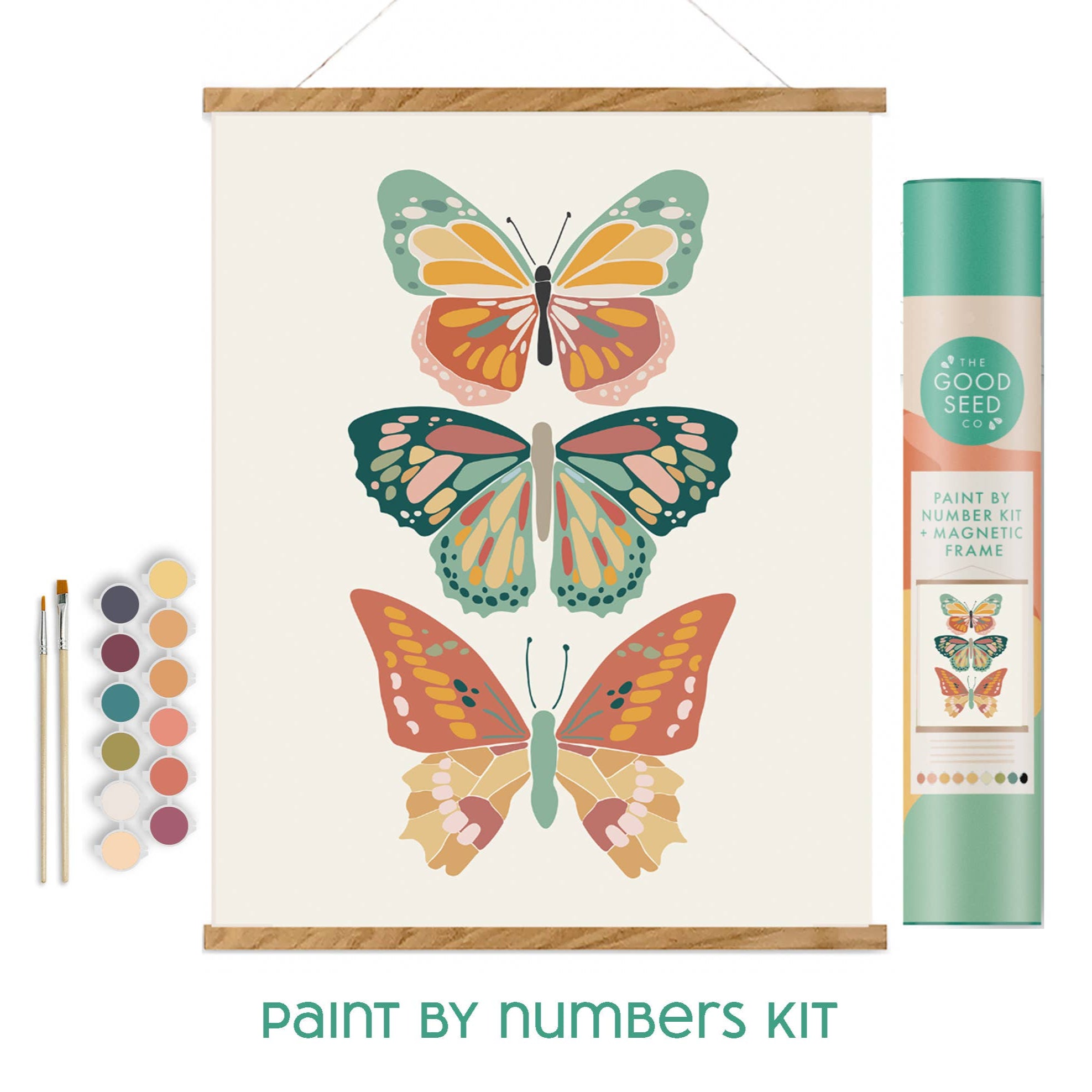Paint by numbers kit with butterflies, paintbrushes, and color swatch on a white background